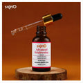 A 30ml glass dropper bottle of Skin'O Advanced Brightening Serum containing Niacinamide and Alpha Arbutin, resting on a clean white background, designed for fading dark spots and hydrating skin.